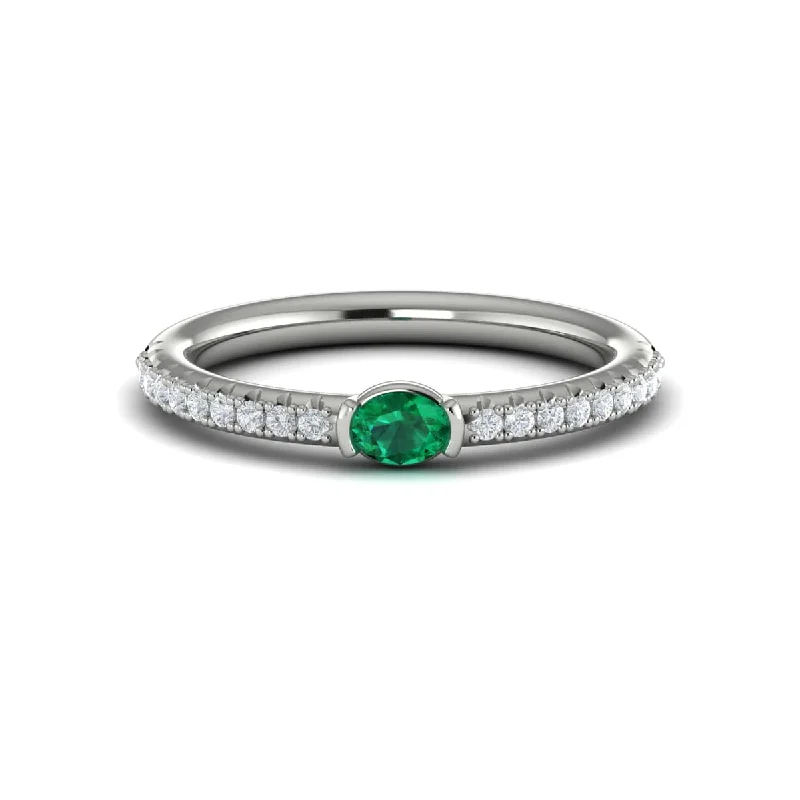 Diamond and Oval Emerald Centerstone Ring