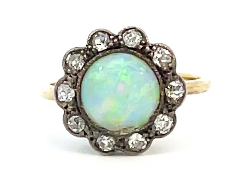 Women’s oval rings-100 Year Old Antique Edwardian Era Opal and Diamond Flower Halo Ring