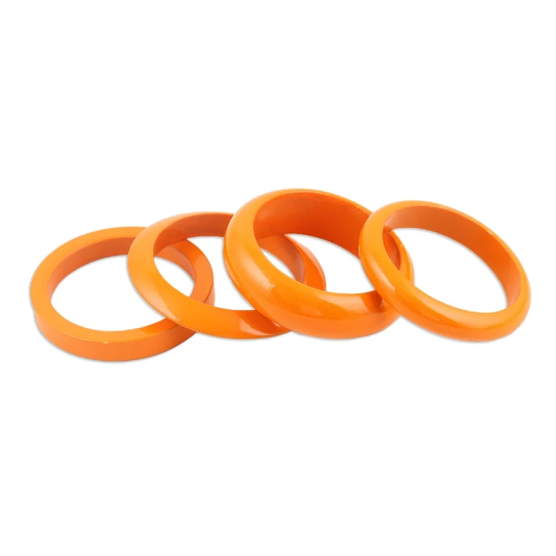 Women’s handmade bracelets-Novica Handmade Orange Fusion Mango Wood Bangle Bracelets (Set Of 4)